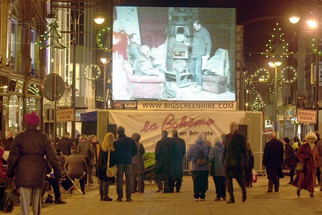 Opera North's La Boheme pop-up screening, to entertain Christmas shoppers on Briggate, Leeds city centre.