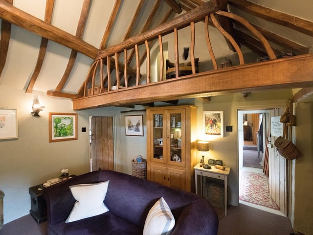 A mezzanine level overlooks the sitting room.