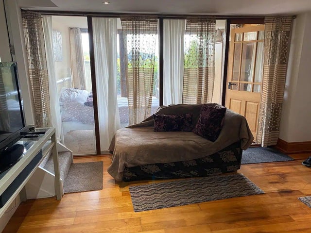 There is a sitting area outside the cottage with lovely views across the surrounding woods.