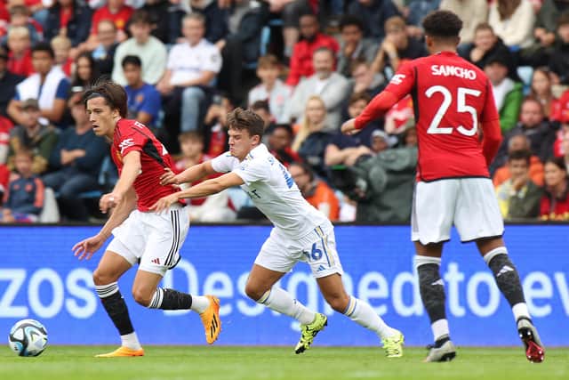EMBRACING THE RETURN: Leeds United's Jamie Shackleton, centre, pictured battling it out with Manchester United's Alvaro Fernandez, left, as Jadon Sancho, right, looks on during this month's pre-season friendly against the Red Devils in Oslo. Photo by Matthew Peters/Manchester United via Getty Images.