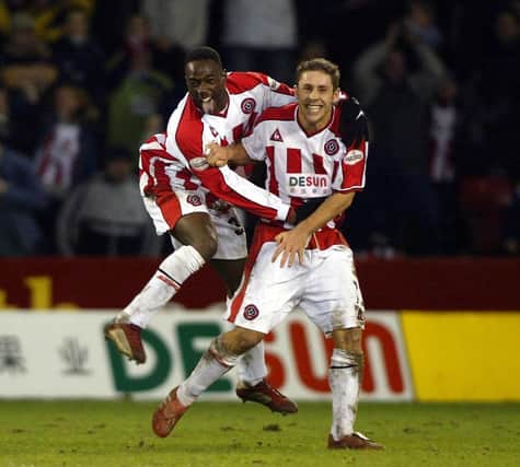 Michael Brown celebrates after his wondergoal against Wednesday in 2003