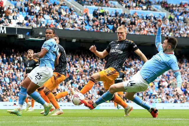 SURPRISE: Leeds United's Rasmus Kristensen, middle, as a centre-back in Saturday's clash against Manchester City at the Etihad.  Photo by LINDSEY PARNABY/AFP via Getty Images.