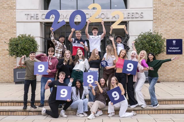 Students celebrate after receiving their GCSE results at The Grammar School in Leeds.