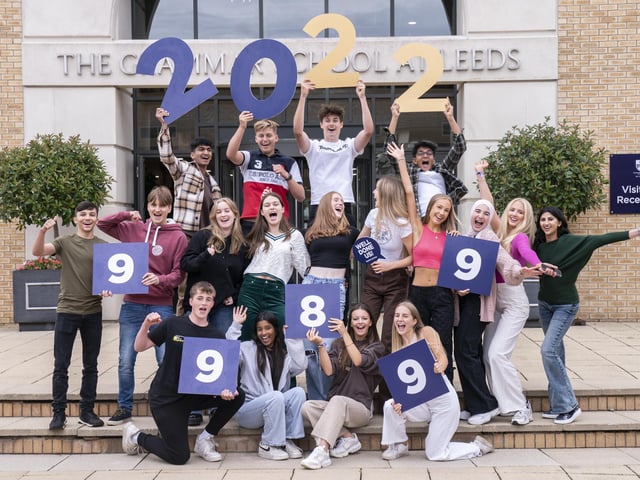 Students celebrate after receiving their GCSE results at The Grammar School in Leeds.
