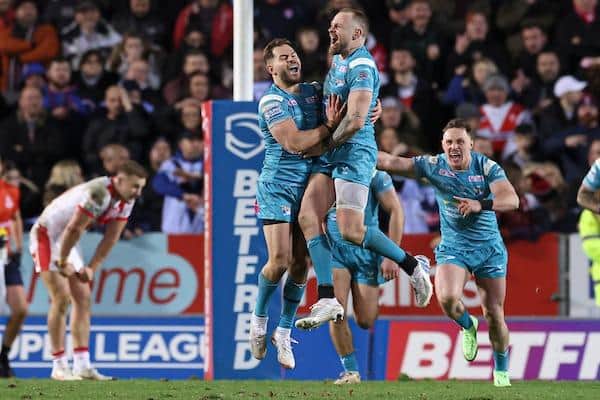 Rhinos' Blake Austin jumps for joy after landing his winning drop goal at St Helens. Picture by Paul Currie/SWpix.com.