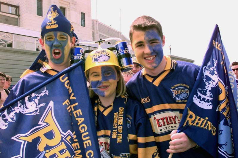 Fans Josh Booth, 13, Lucy Scollen, 18, and Richard Banks, 14, get in the mood for the big match.