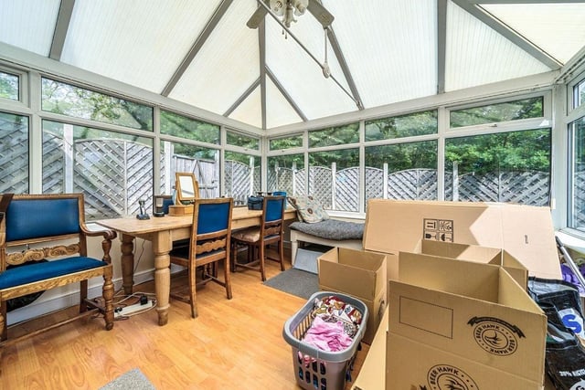 A large conservatory offers further reception space, ideally for the family or further development.