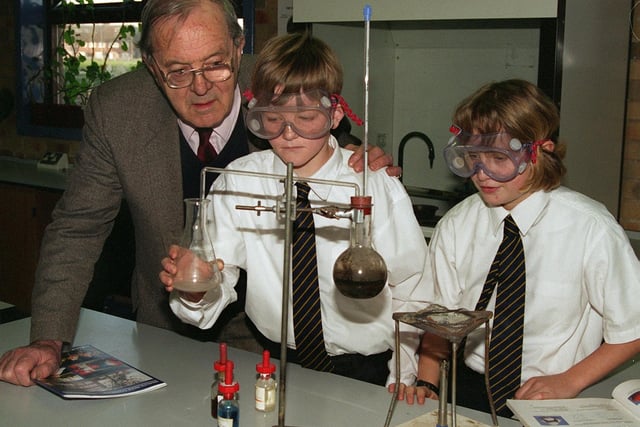Lord Merlyn-Rees pictured on a visit to the school named after him in February 1998. He is pictured with Year 7 pupils Des Bingham and Dawn Kellett.