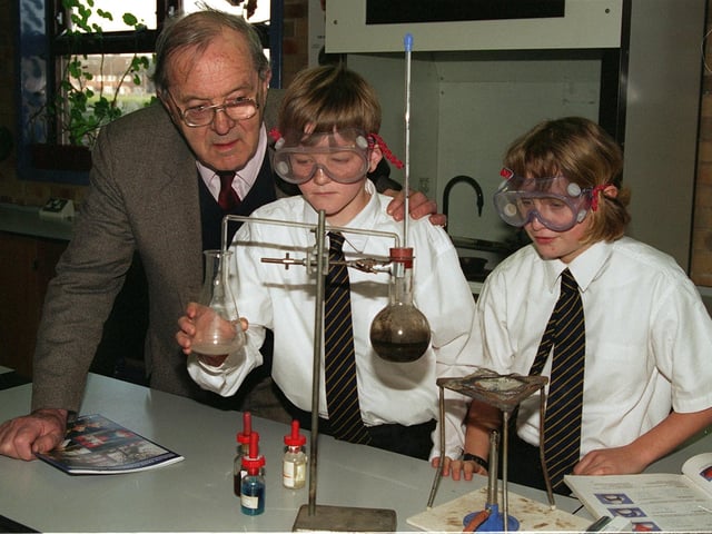 Lord Merlyn-Rees pictured on a visit to the school named after him in February 1998. He is pictured with Year 7 pupils Des Bingham and Dawn Kellett.