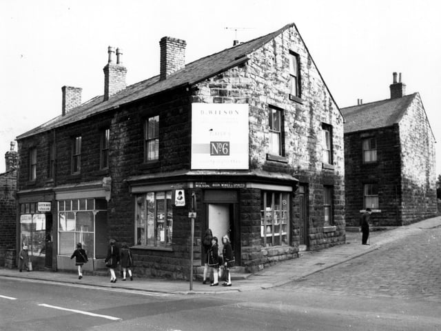 Morley's Fountain Street at the junction with Great Northern Street in July 1971. The general store, owned by Doris Wilson can be seen on the corner with a group of schoolgirls on the steps outside.
