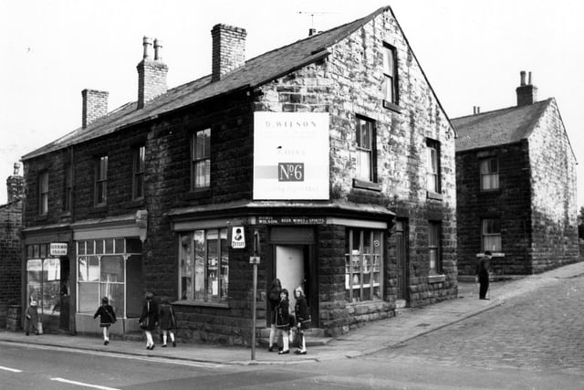 Morley's Fountain Street at the junction with Great Northern Street in July 1971. The general store, owned by Doris Wilson can be seen on the corner with a group of schoolgirls on the steps outside.