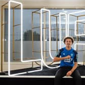 Ethan Ampadu performs the Leeds salute after signing a four-year deal at Elland Road (Pic: Leeds United)