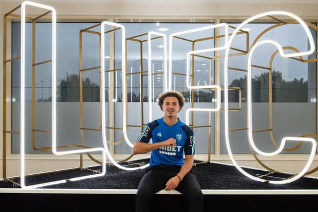 Ethan Ampadu performs the Leeds salute after signing a four-year deal at Elland Road (Pic: Leeds United)