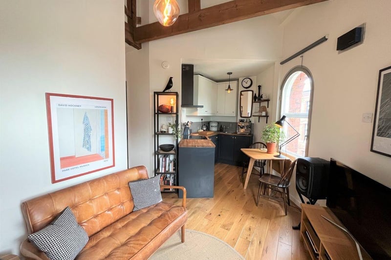 The open plan living area has engineered oak flooring throughout and underfloor heating. Two arched windows with secondary glazing overlooking The Calls. Double height vaulted ceiling with exposed original beams.