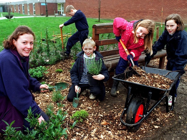Children at Whitkirk Primary are pictured building a memorial garden to a former pupil with the help of the Temple Newsam ranger service in November 1997. The garden which ajoins the school playground, includes seating and hardy plants. Pictured is Cath Brayson, a voluntary education officer with Temple Newsam ranger service, with pupils Ashley Hudson, Charlotte Bunn and Katie Crowe.