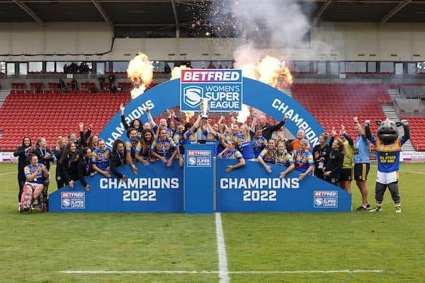 Rhinos celebrate with the trophy after their 2022 Grand Final win over York at St Helens. Picture by John Clifton/SWpix.com.