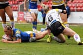Caitlin Beevers scores for Rhinos. Picture by John Clifton/SWpix.com.