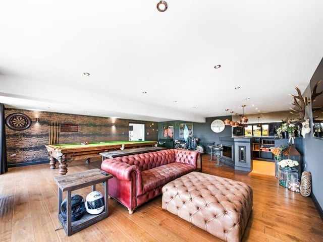 The games room and lounge with built-in bar.