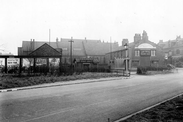 Station Road looking towards Austhorpe Road. To the right can be seen the Travellers Rest public house which fronts onto Austhorpe Road.Beyond it the Methodist Church and Church Institute are visible. To the left are some hoardings with posters for Theatre Royal and Grand Theatre.
