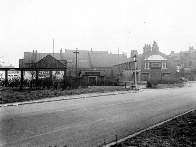 Station Road looking towards Austhorpe Road. To the right can be seen the Travellers Rest public house which fronts onto Austhorpe Road.Beyond it the Methodist Church and Church Institute are visible. To the left are some hoardings with posters for Theatre Royal and Grand Theatre.