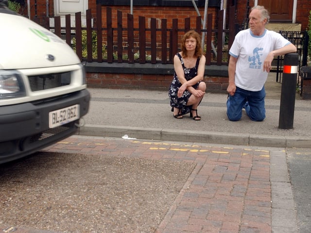 Speed humps on Tempest Road were driving residents to distraction in August 2003. Pictured are locals Christine Ward and Eddie Myers.