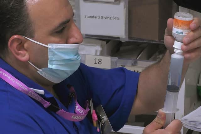 Stroke nurse Zaki administers medicine in the new episode of 24 Hours in A&E (Picture: Channel 4)