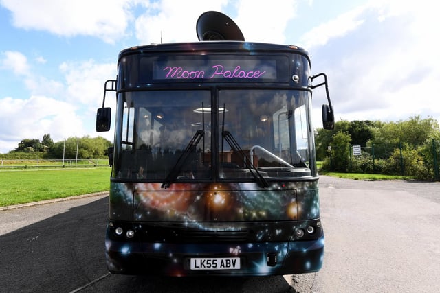The Moon Palace touring bus used to be a functional school bus before it was taken on for this project. The bus has been stripped down but artists Heather Peak and Ivan Morison kept the seats of the original bus for the project.
