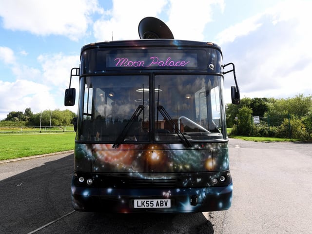 The Moon Palace touring bus used to be a functional school bus before it was taken on for this project. The bus has been stripped down but artists Heather Peak and Ivan Morison kept the seats of the original bus for the project.