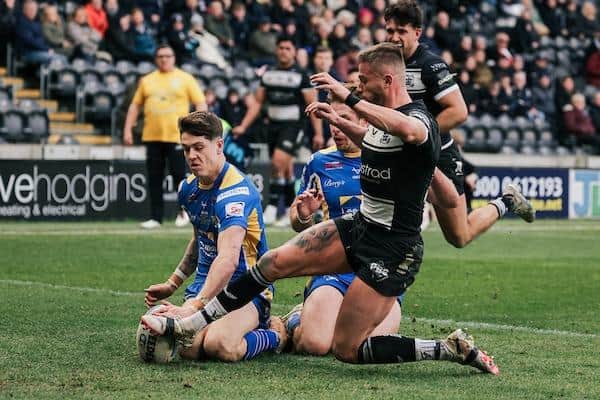 Debutant Riley Lumb scores the second of his brace of tries in Leeds Rhinos' win at Hull FC. Picture by Alex Whitehead/SWpix.com.