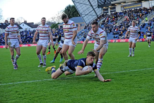 Morgan Gannon scores for Rhinos against Wakefield in the 2022 Boxing Day game. Pcture by Steve Riding.