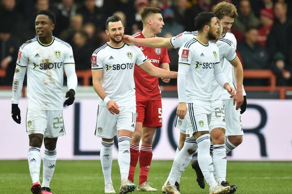 ADVICE: On Jack Harrison. centre, as Leeds United's fans cast their verdict on Saturday's 3-1 win at Accrington, above, in the FA Cup fourth round. 
Photo by PETER POWELL/AFP via Getty Images.