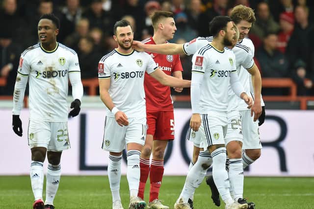 ADVICE: On Jack Harrison. centre, as Leeds United's fans cast their verdict on Saturday's 3-1 win at Accrington, above, in the FA Cup fourth round.
Photo by PETER POWELL/AFP via Getty Images.