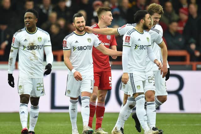 ADVICE: On Jack Harrison. centre, as Leeds United's fans cast their verdict on Saturday's 3-1 win at Accrington, above, in the FA Cup fourth round. 
Photo by PETER POWELL/AFP via Getty Images.