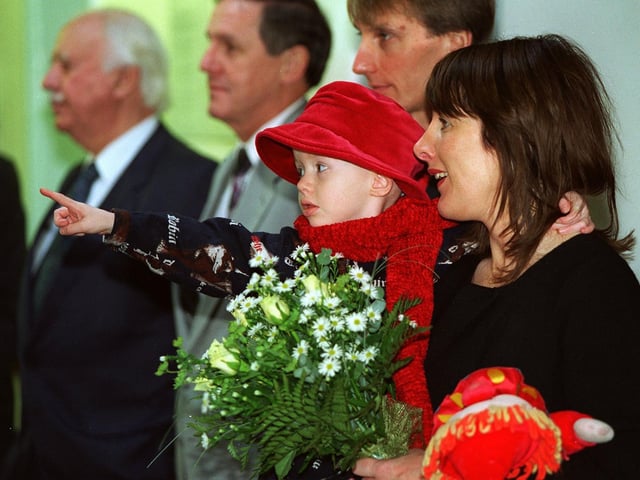 Young Olivia Crook points out the Princess Royal to her mum Christine as the wait to present some flowers to the Princess during a visit to Cookridge Hospital in November 1996.