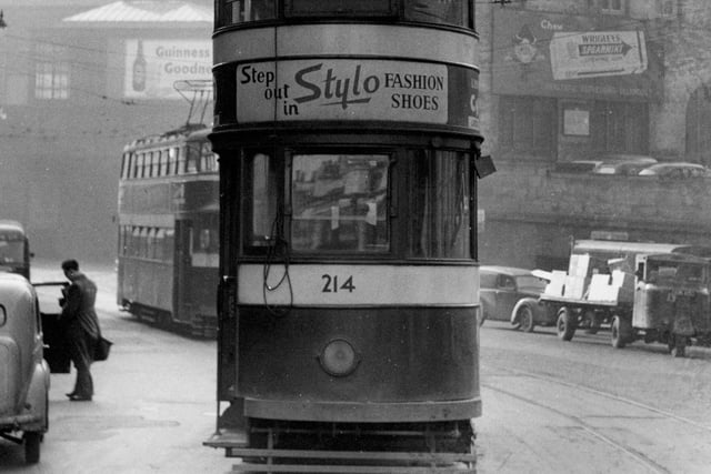 Tram number 214 travelling alone on Bishopgate Street in Leeds city centre in March 1956.