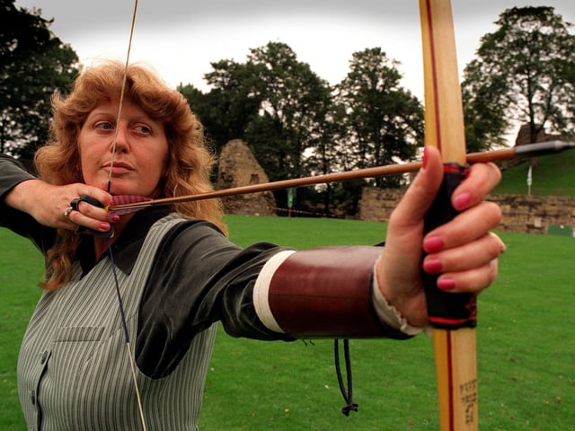 September 1996 and Gillian Breeze of The Wakefield Archers, takes aim with her 40lb pull longbow in the Pomfret 60 Longbow Tournament at Pontefract Castle.