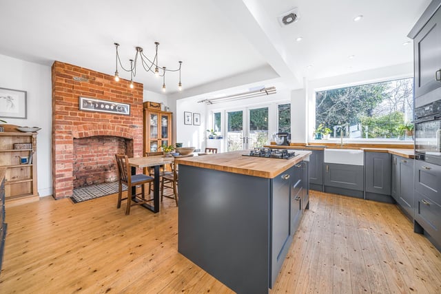 At the heart of this home is an impressive extended open plan kitchen diner with a central island, integrated appliances, a spacious dining area and a further feature fireplace.
