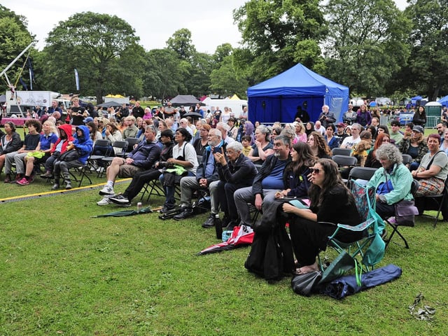 The umbrellas are put away, for now, as the audience soak up the performances. (pic by Steve Riding)