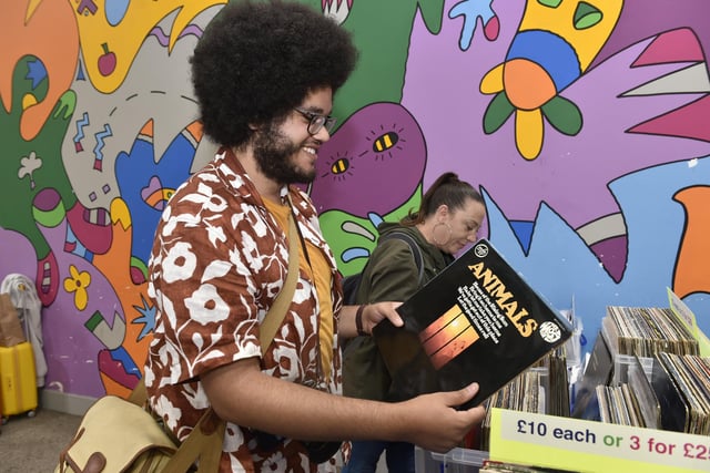 Adam French of Headingley browses vintage vinyl at Kirkgate Market