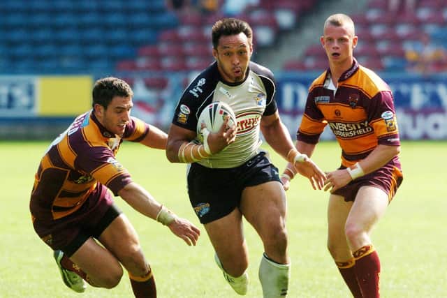 Willie Poching on the attack for Rhinos against Huddersfield in 2006. Picture by Steve Riding.