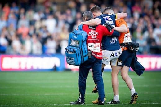 Morgan Gannon is helped from the field after his injury against St Helens in May. Picture by Allan McKenzie/SWpix.com.
