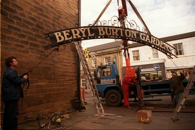 Workmen start to raise the Beryl Burton Arch into place on Queeen Street in November 1997.