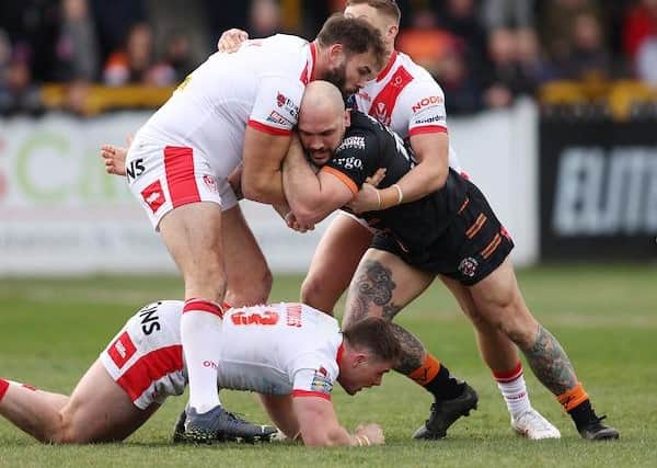 Tigers' George Griffin tackled by Alex Walmsley of St Helens earlier this season. Picture by John Clifton/SWpix.com.