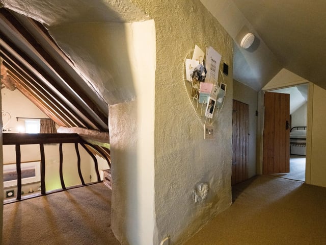 The cottage interior is quaint and full of character.