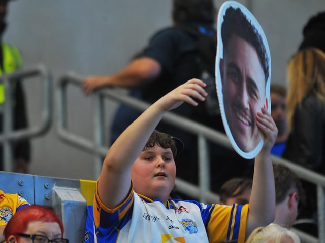 A young fan in the South Stand shows off his favourite player.