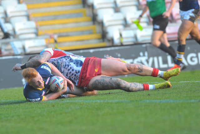 Luis Roberts scores for Rhinos in a pre-season game at Leigh. Picture by Steve Riding.
