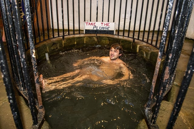 Ben Stewart braves the cold water in the plunge pool at White Wells on Ilkley Moor