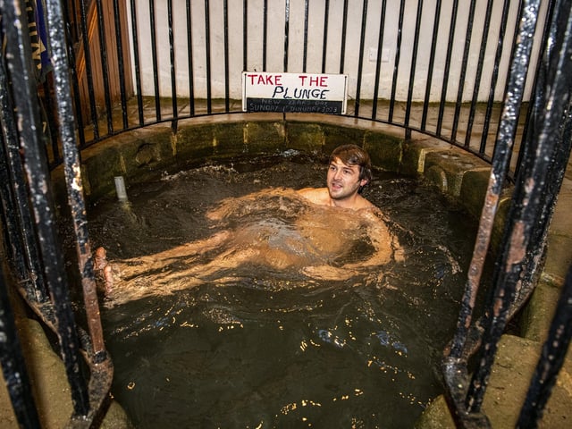 Ben Stewart braves the cold water in the plunge pool at White Wells on Ilkley Moor