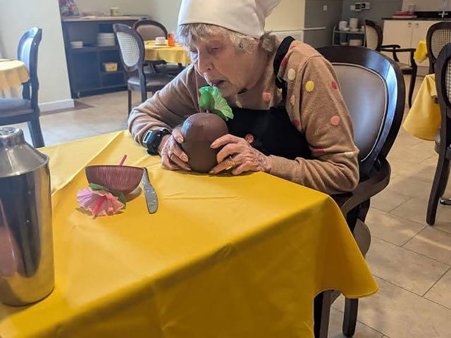Resident enjoying cocktail and mocktail bar making workshop at HC-One’s Augustus Court Care Home during Care Home Open Week