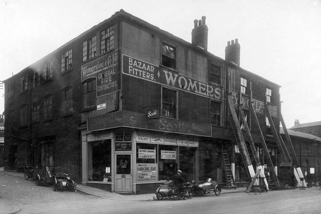 Woodhouse Lane in August 1929. On the left is the junction with Back Rockingham Street. Next, moving to the right is the premises of Pointing Ltd, motor car agents and dealers in Scott motor cycles. Then and occupying the upper floors, is Womersley and Co Ltd bazaar fitters and suppliers of marquees, awnings, ballroom decorations. It is followed by William Primley, tailors shop. Next is Miss Elsie Morris, milliner. The Albion Brewery is on the right. After this property was demolished the site was used for a static water tank during the war years. It is now part of the Merrion Centre.